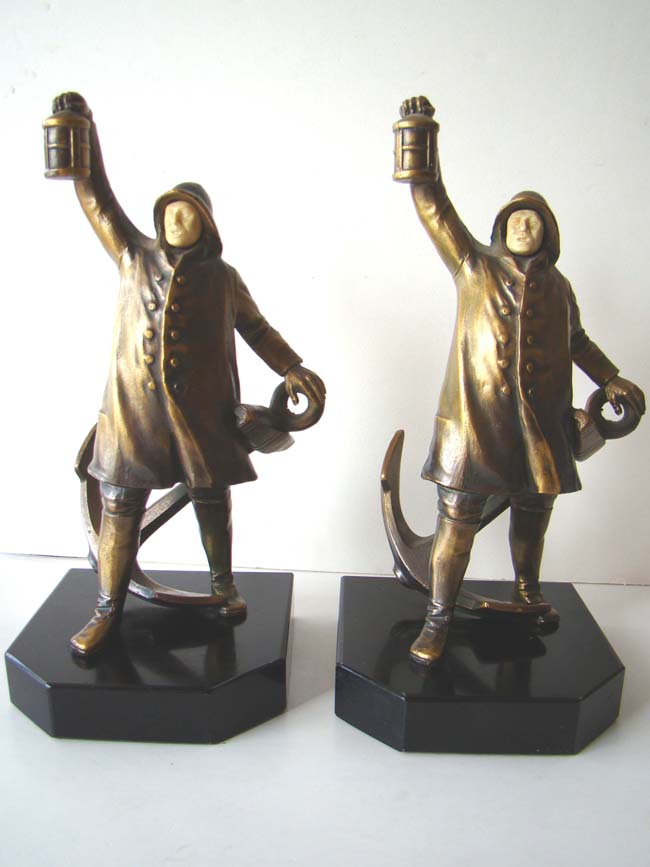 A wonderful pair of Antique Bookends circa 1931 depicting a sailor holding a lantern